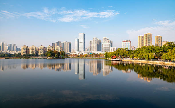 istock Modern Skyline Reflected on a Calm Lake in Wuhan, China 2248649262