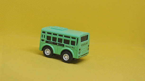 istock Cute miniature green school bus toy model ready for playtime adventures and learning fun for kids 2248650299