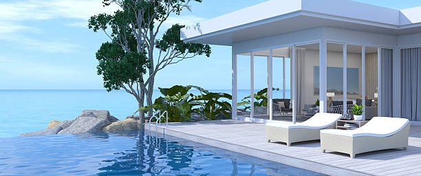 Photo of a mid adult man sitting on the edge of the infinity pool
