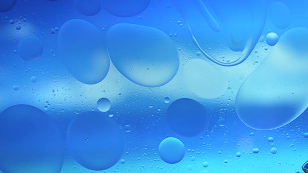 istock Abstract Colorful Organic Food Oil Drops Bubbles On Water Surface 2248650914