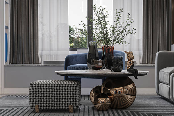 istock Luxury Modern Coffee Table Close-Up with Marble Top, Geometric Ottoman, and Window View 2248650979
