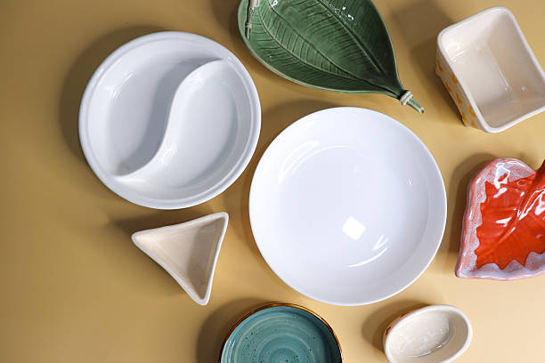 istock Composition with clean and colorful ceramic plates and bowls on yellow background 2248652061