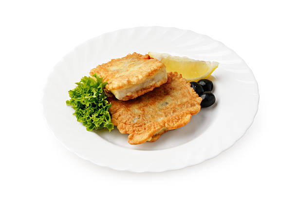 istock Delicious crispy fish fillets served with lettuce and lemon slice 2248656272