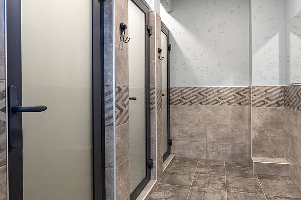 istock Modern restroom with stylish stalls and elegant tile design in a clean space 2248657753