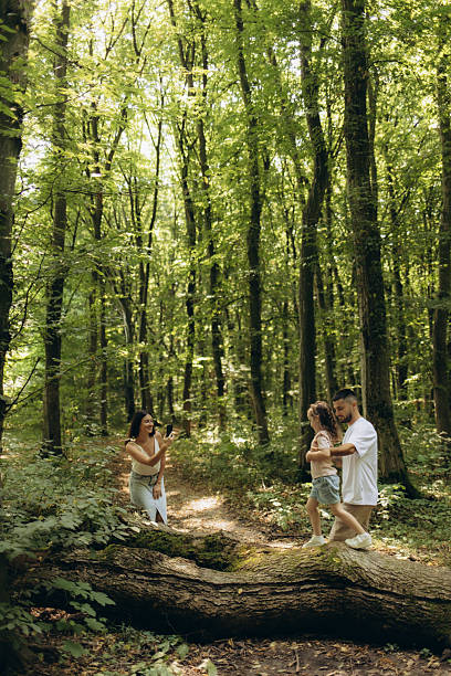 istock Happy Family Spending Quality Time in a Quiet Forest Nature Setting 2248658058