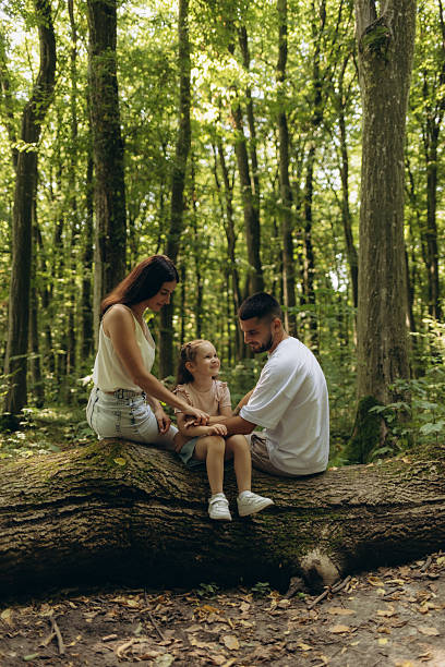 istock Family Enjoying Quality Time Together in a Serene Forest Environment 2248658063