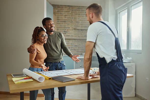istock Happy black couple talking about plans with their manual worker. 2248659306