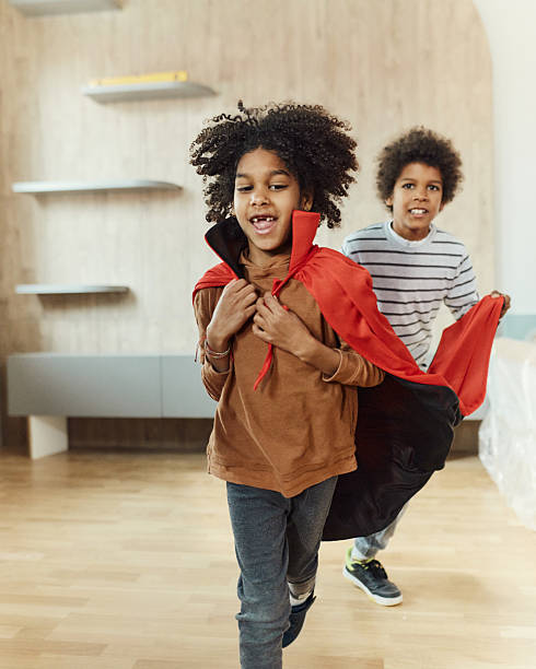 istock Happy black kids having fun after moving into a new apartment. 2248659342