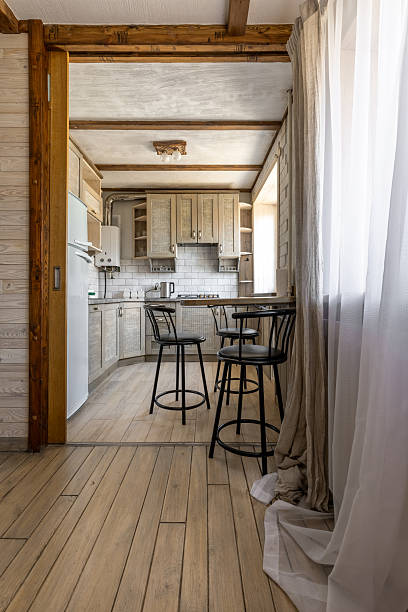 istock Bright Rustic Kitchen Interior with Wooden Cabinets and Bar Stools 2248660270