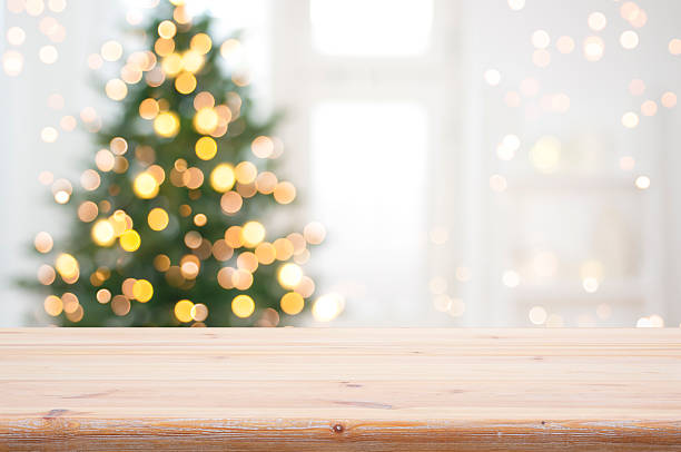 istock Empty table for product display montage in front of blurred Christmas tree lights background 2248660342