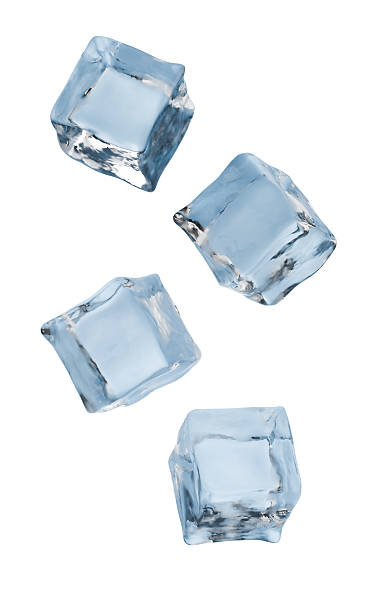 istock 3D rendered image of four clear blue ice cubes falling or floating against 2248660583