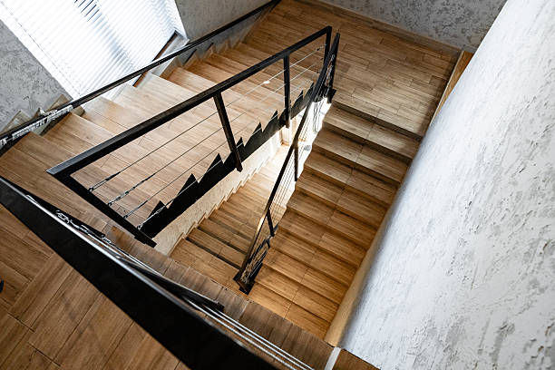 istock Staircase view showing wooden steps and metal railing in modern interior design 2248661142