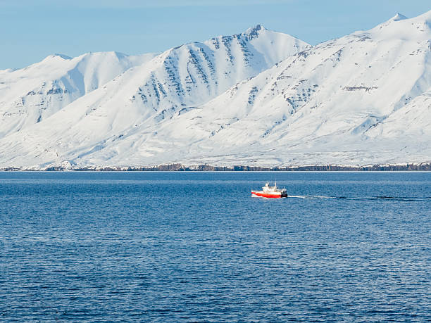 istock A small red boat on the blue water 2248668240