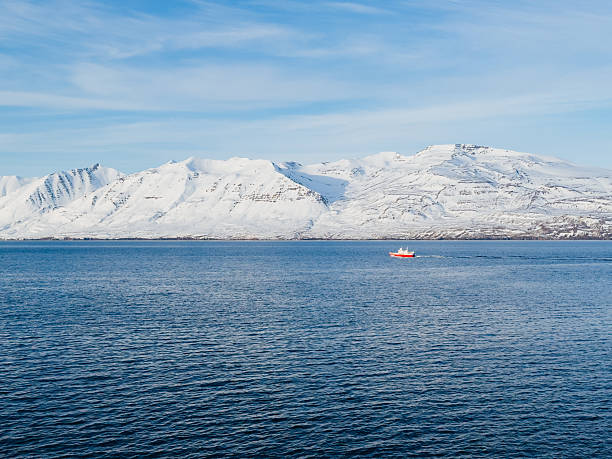 istock A small red boat on the blue water 2248668281