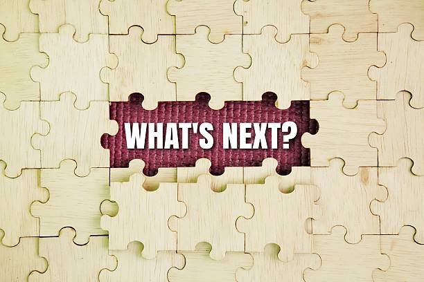 istock Wooden puzzle with the word question What's Next? 2248670271