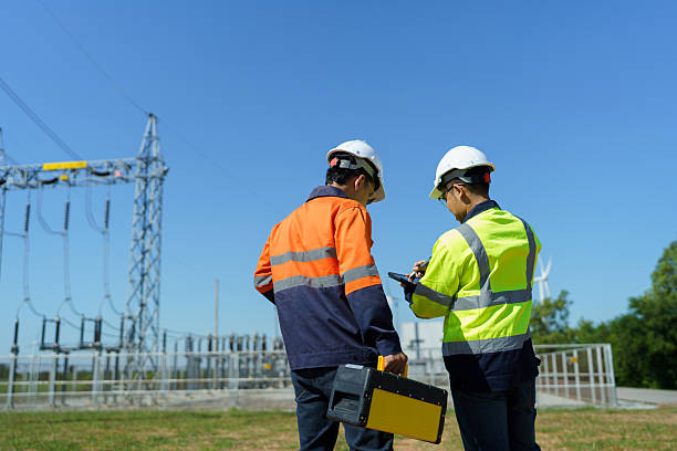 istock Engineers are checking the operation of a large wind turbine that is working to generate electricity in a wind farm. 2248675643