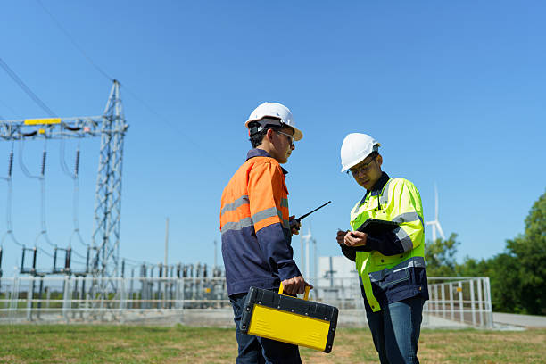 istock Engineers are checking the operation of a large wind turbine that is working to generate electricity in a wind farm. 2248675644
