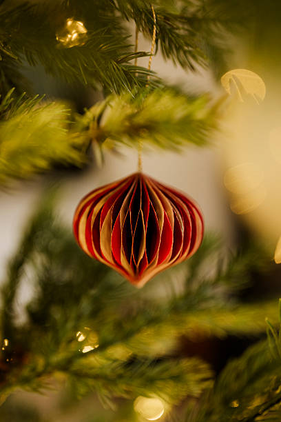 istock Christmas ornament bauble close up hanging in tree low key 2248676097
