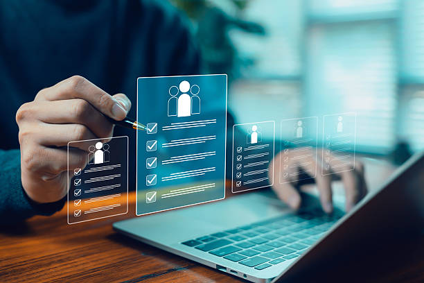 istock Hands working on a laptop with floating checklist and user profile icons represent task management, project planning, productivity workflow, digital organization, efficient team management for modern 2248676110