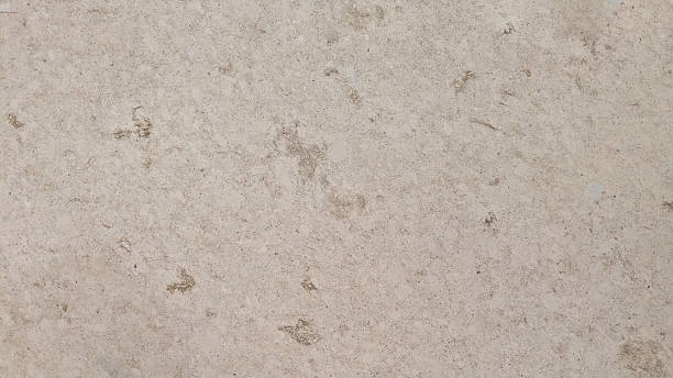 istock A close-up view of a textured stone surface with natural variations in color and pattern. 2248676338