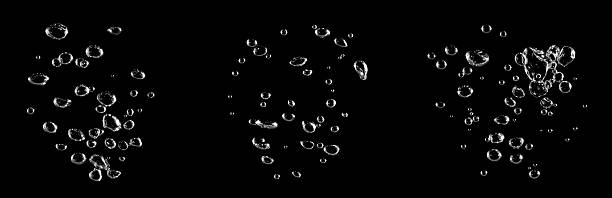 istock Close-up bubbles rising in clear water against a black background, capturing purity, freshness, and clean liquid motion, ideal for science concepts, hydration themes, product ads, commercial visuals. 2248677416