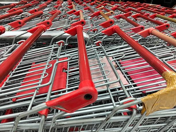 istock Row of shopping baskets with red handles 2248680969