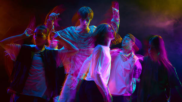 istock Urban dancers in expressive motion blur light performance 2248681223