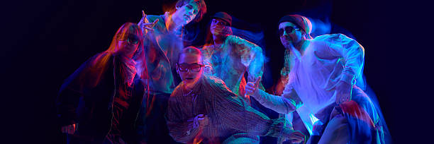 istock Street dancers posing under vivid motion blur lights. Banner 2248681230