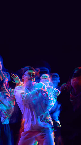 istock Neon motion blur captures dancers in energetic street performance 2248681233