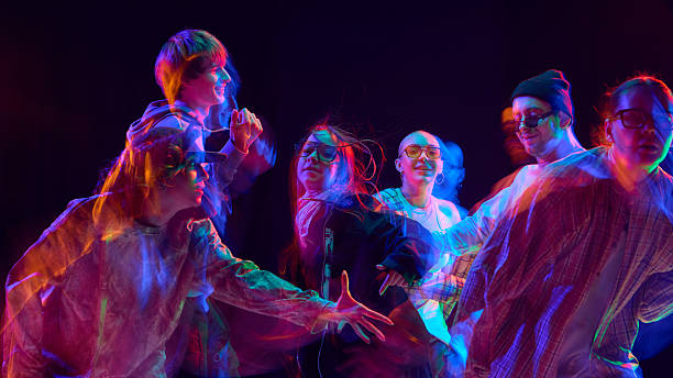 istock Street dance group illuminated by vibrant motion blur light 2248681234