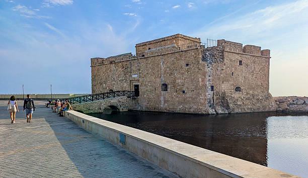 Paphos, Cyprus – November 10. 2025: A view of Paphos Castle, a medieval fortress and popular tourist attraction, situated at the edge of the harbor, connected to the land by a stone bridge.