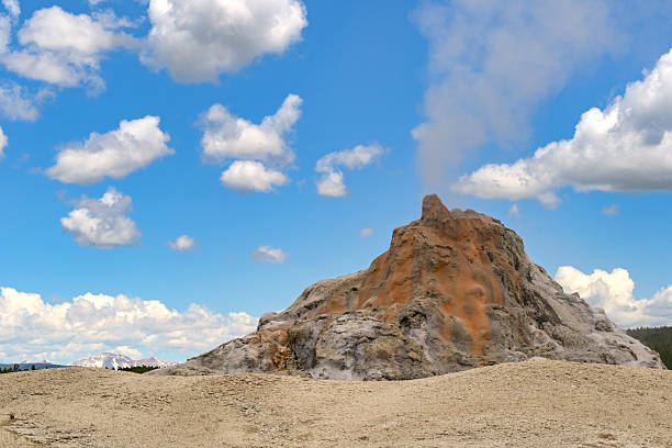 istock White Dome Geyser erupting in Yellowstone National Park 2248684419