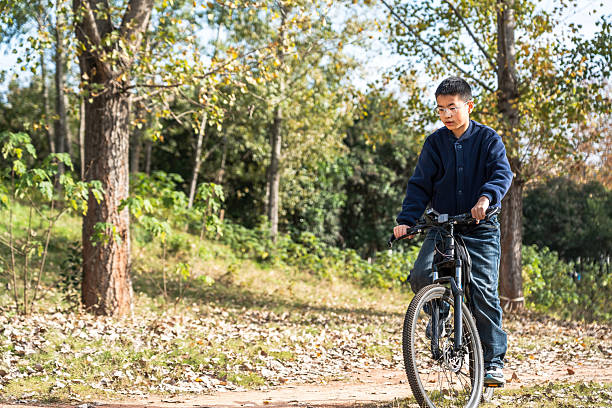 istock A man riding a bicycle in a forested area 2248685408