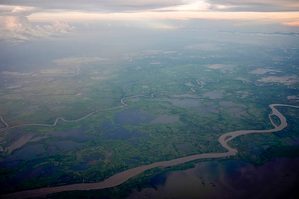 The amazon river aerial view from airplane window at sunset