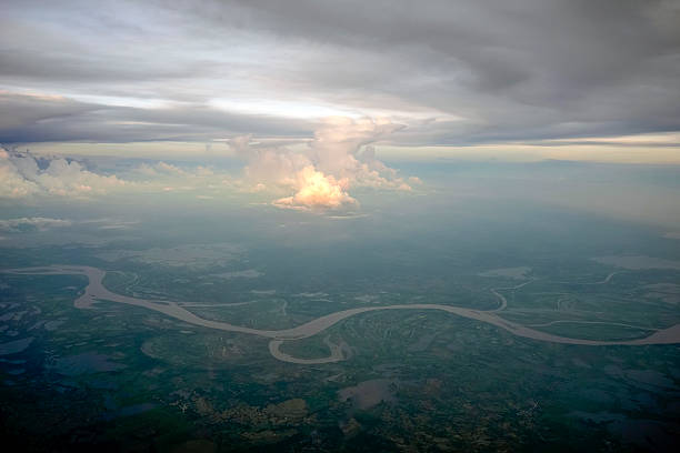 The amazon river aerial view from airplane window at sunset