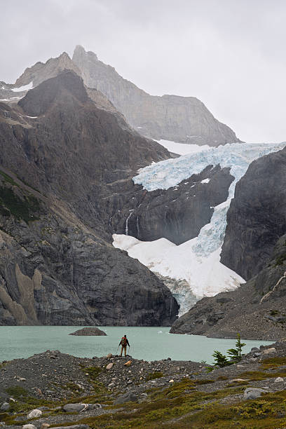istock Hiker standing by Laguna Los Perros below massive glacier, Patagonia, Chile 2248687878