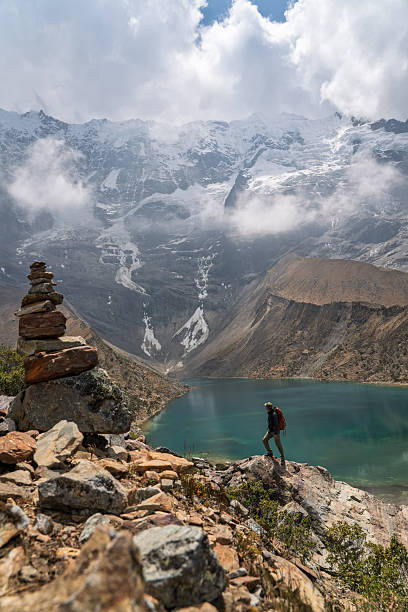 istock Hiker standing by turquoise Laguna Humantay under snowy glacier, Peru 2248688313