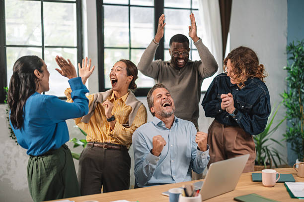 istock Excited Team Celebrating a Successful Project Outcome 2248691043