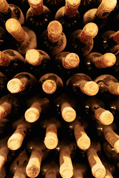 istock Top view of vintage wine bottles with corks in cellar environment 2248691912