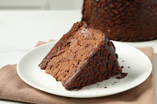 istock Piece of delicious chocolate truffle cake on table, closeup 2248692045