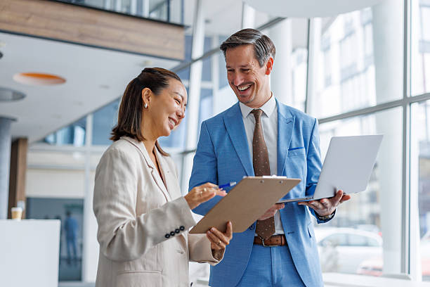 istock Business colleagues collaborating and discussing workflow in modern office 2248692681