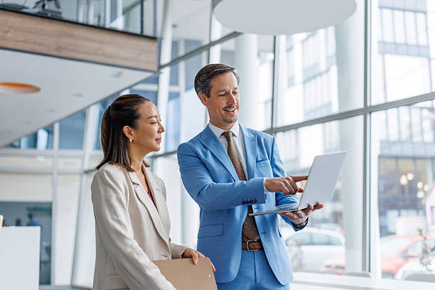 istock Business colleagues collaborating on laptop in modern office 2248692770