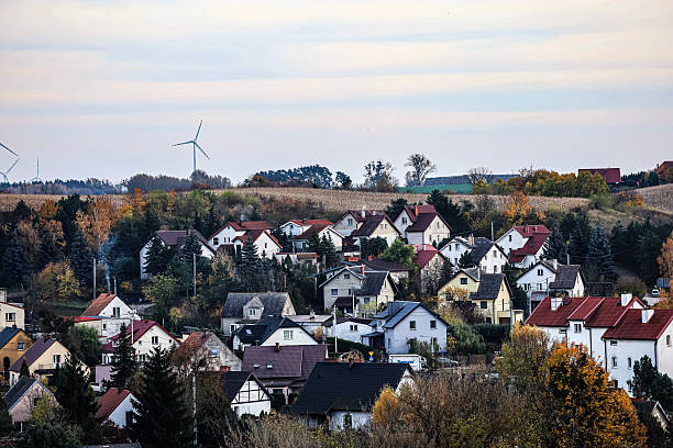 istock Small Village on Hillside with Wind Turbine 2248694744