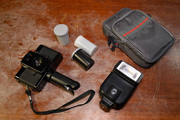 istock old camera with accessories and case on wooden background 2248694990