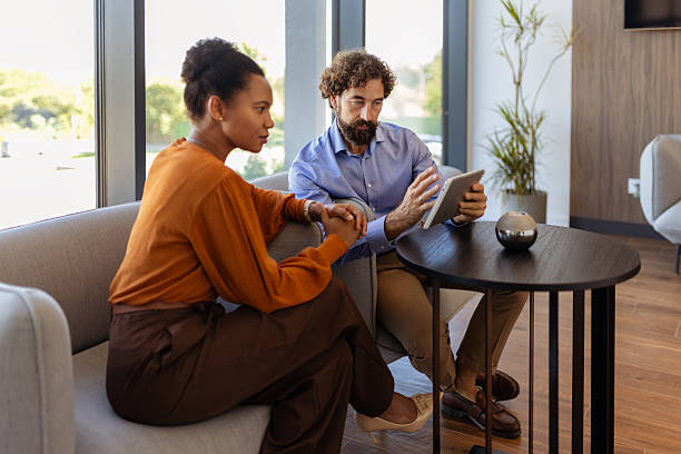 istock Inclusive Workplace Partnership: Multiracial Professionals Reviewing Project on Tablet 2248697516