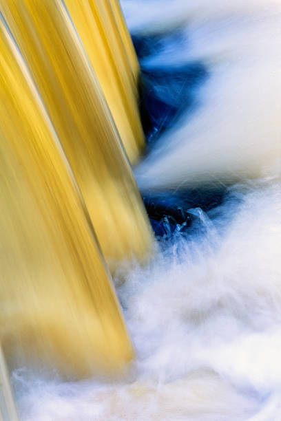 Abstract falling water in a river in long exposure