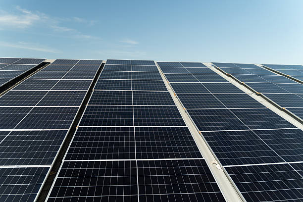 istock Solar panels absorb sunlight at a renewable energy facility on a clear day 2248702057