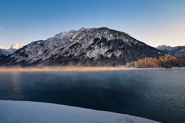 istock Vast, calm lake scene covered in dense mist, emphasizing gray and white tones for minimalist copy space 2248702370