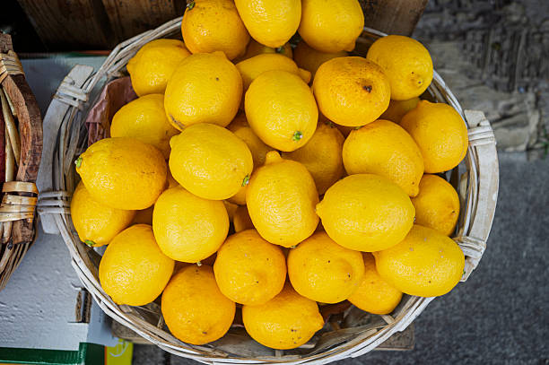 istock Lemons in a wicker basket on a market stall 2248705702