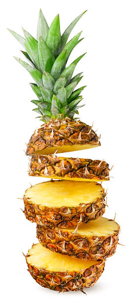 istock Ripe pineapple cut into pieces flies close-up on a white background. Isolated 2248705860